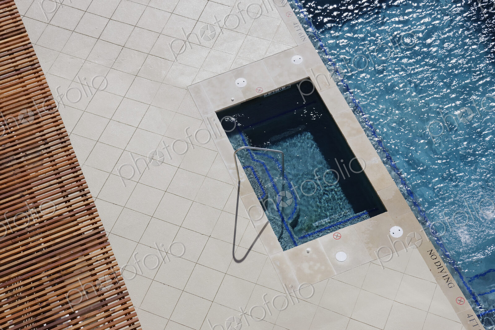 Hot Tub Next to Swimming Pool