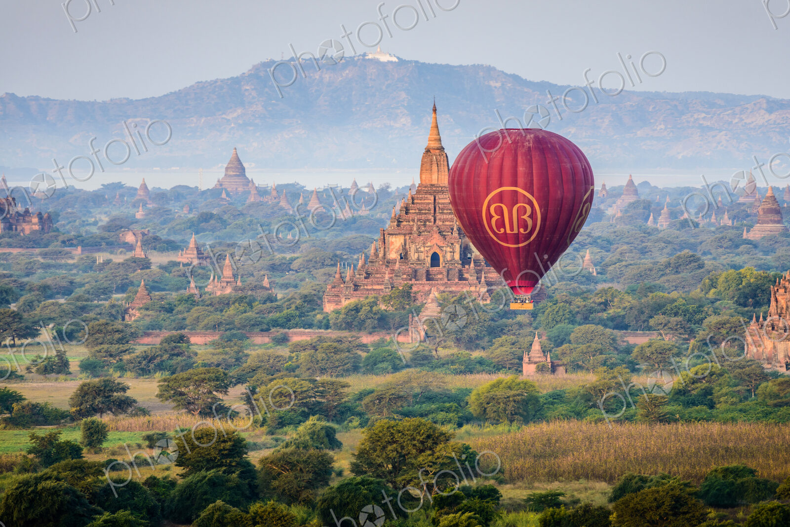 Hot air balloon in the air above the plain of temples in Mandalay