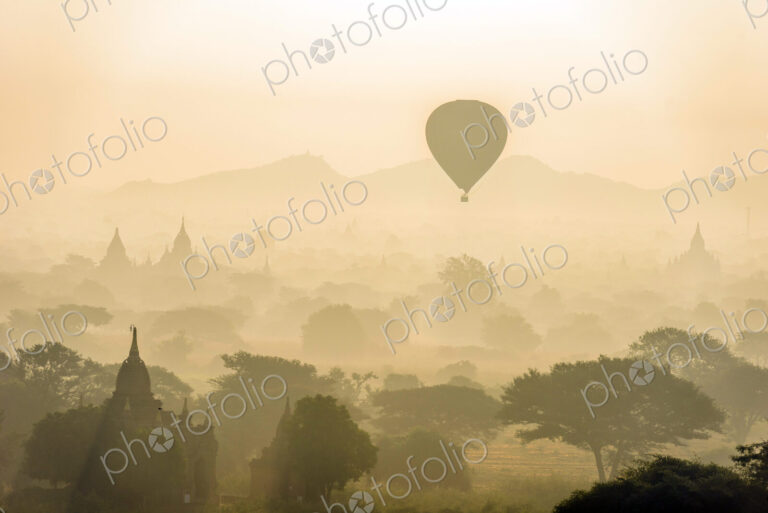Hot air balloon in the air above the plain of temples in Mandalay
