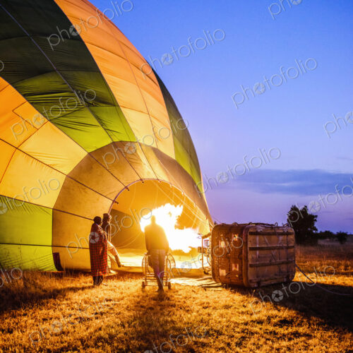 Hot air balloon inflating in rural field Hot air balloon inflating in rural field