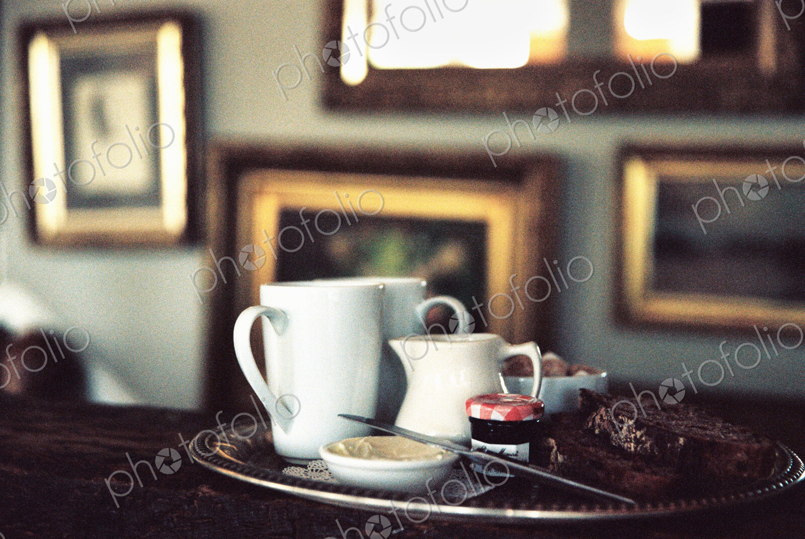 Hotel, A tea tray on a table in a room full of pictures.