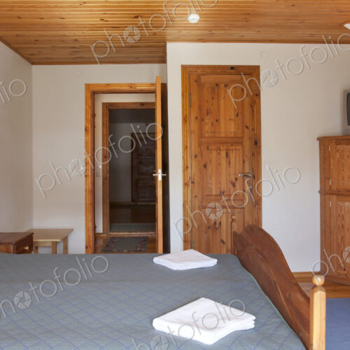 Hotel Bedroom With Wood Ceilings
