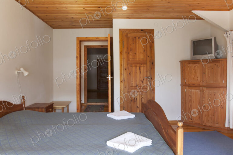 Hotel Bedroom With Wood Ceilings