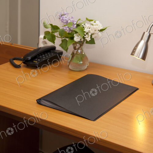 Hotel Room Desk with phone, pad and angled light Hotel Room Desk with phone, pad and angled light