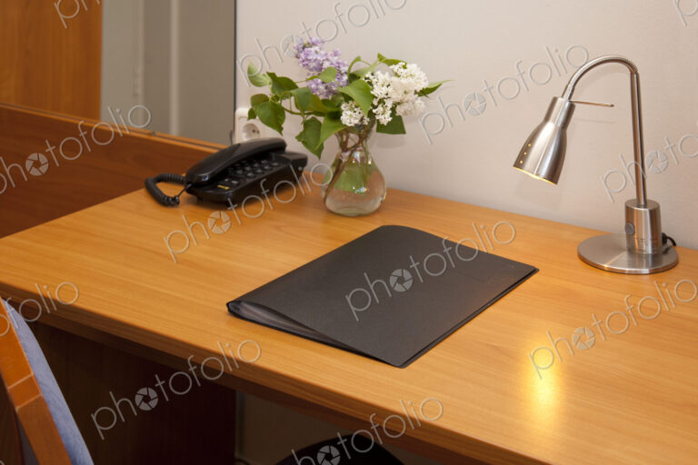 Hotel Room Desk with phone, pad and angled light