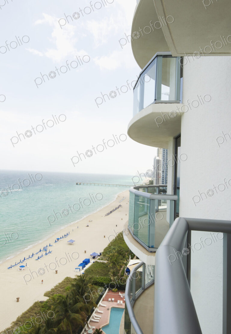 Hotel balcony overlooking urban beach
