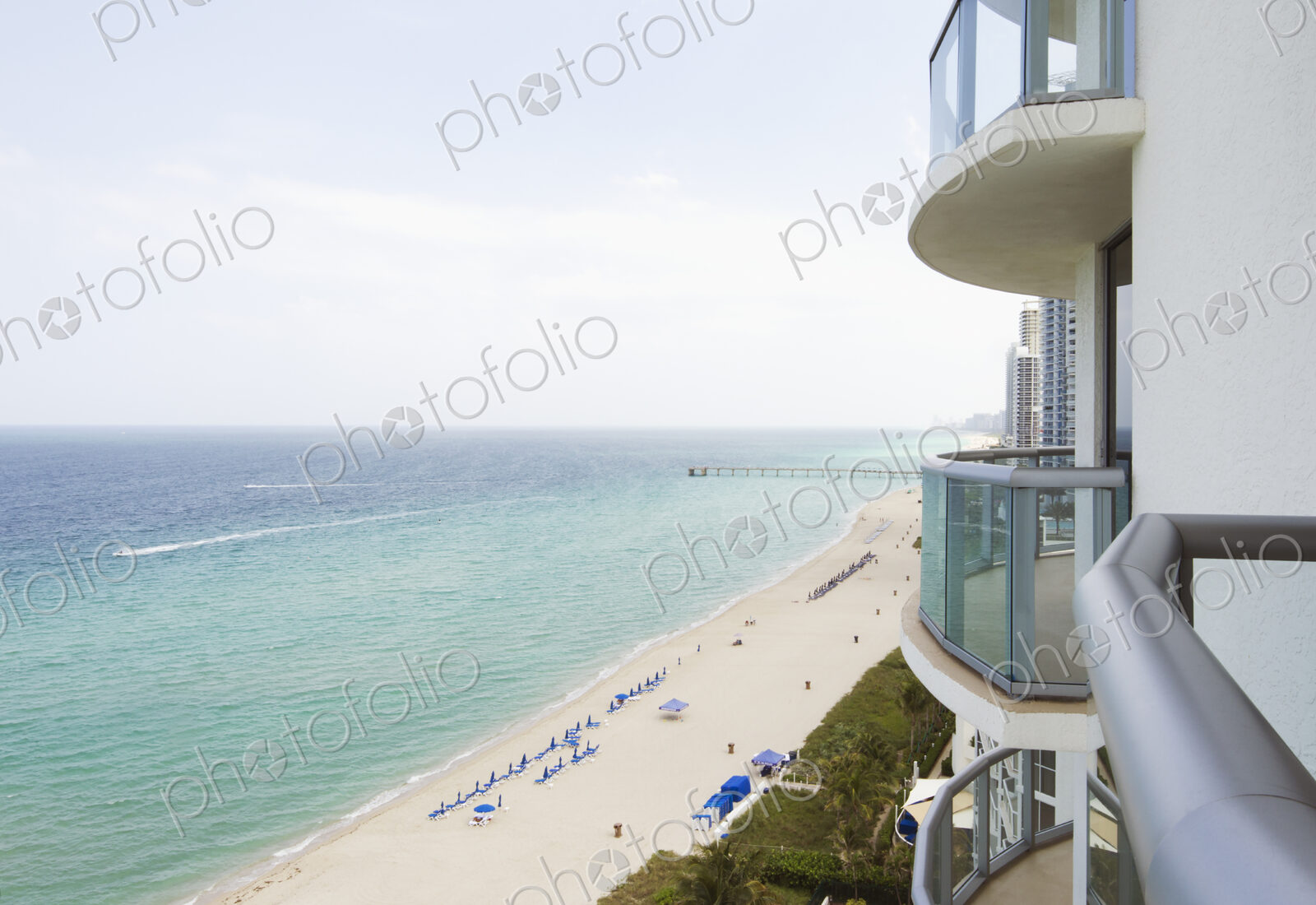 Hotel balcony overlooking urban beach