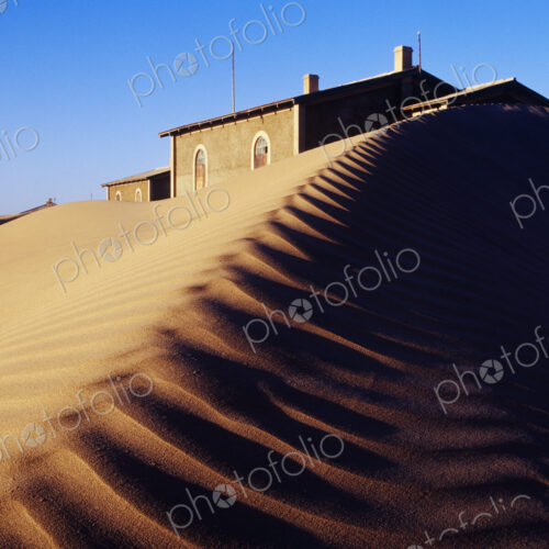 House Buried in Sand