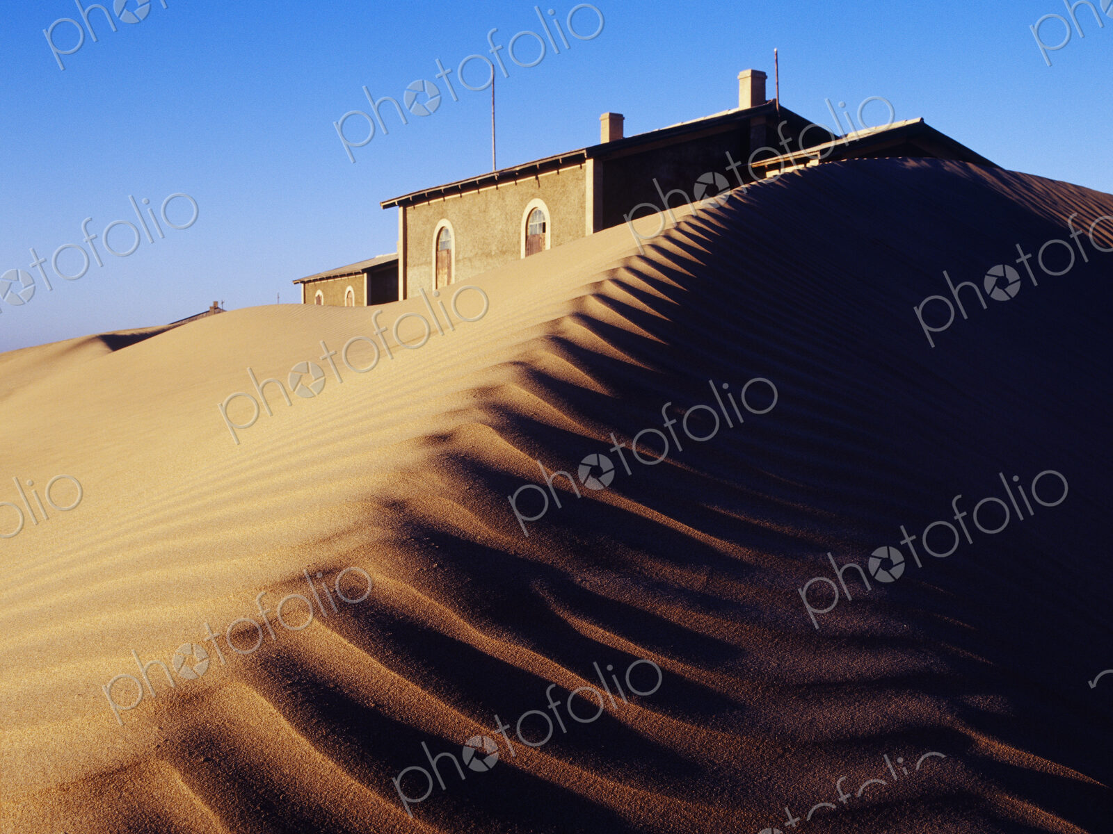 House Buried in Sand