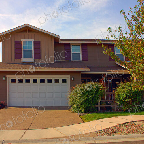 House and driveway in suburban neighborhood House and driveway in suburban neighborhood