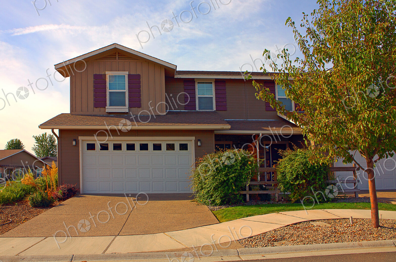 House and driveway in suburban neighborhood