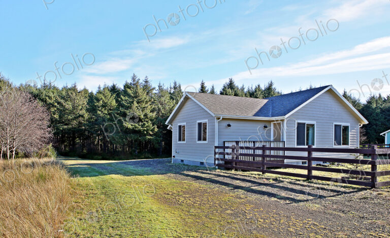House and fenced yard in rural setting