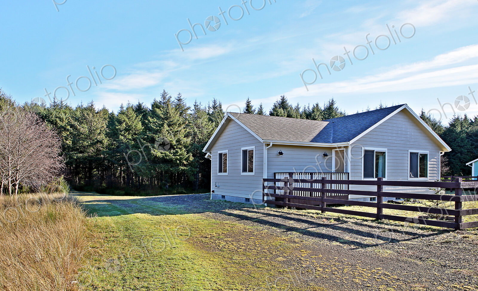 House and fenced yard in rural setting