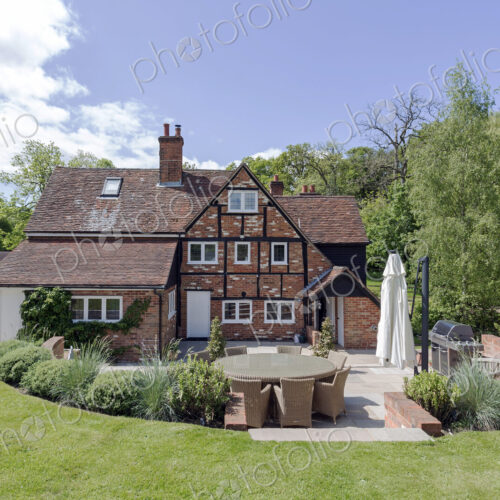 House and manicured backyard lawn