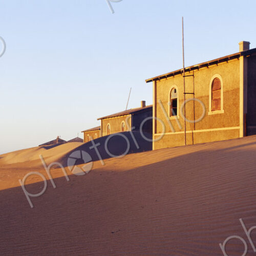 Houses buried in sand in deserted village. Houses buried in sand in deserted village.