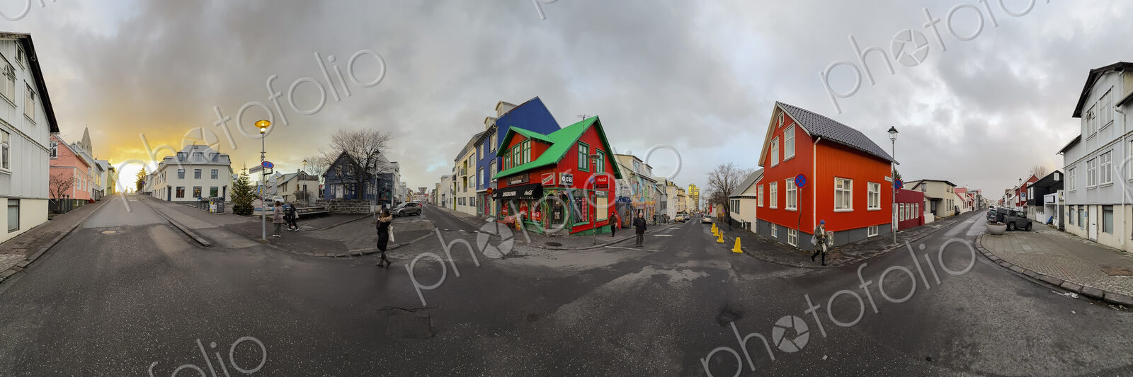 Houses on a street corner in Reykjavik, colourful paintwork and roofs, a stormy cloudy…