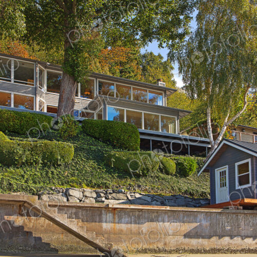 Houses on hillside at waterfront Houses on hillside at waterfront