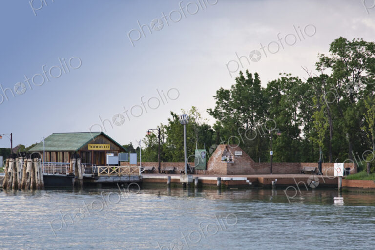 Hut and wall on waterfront.