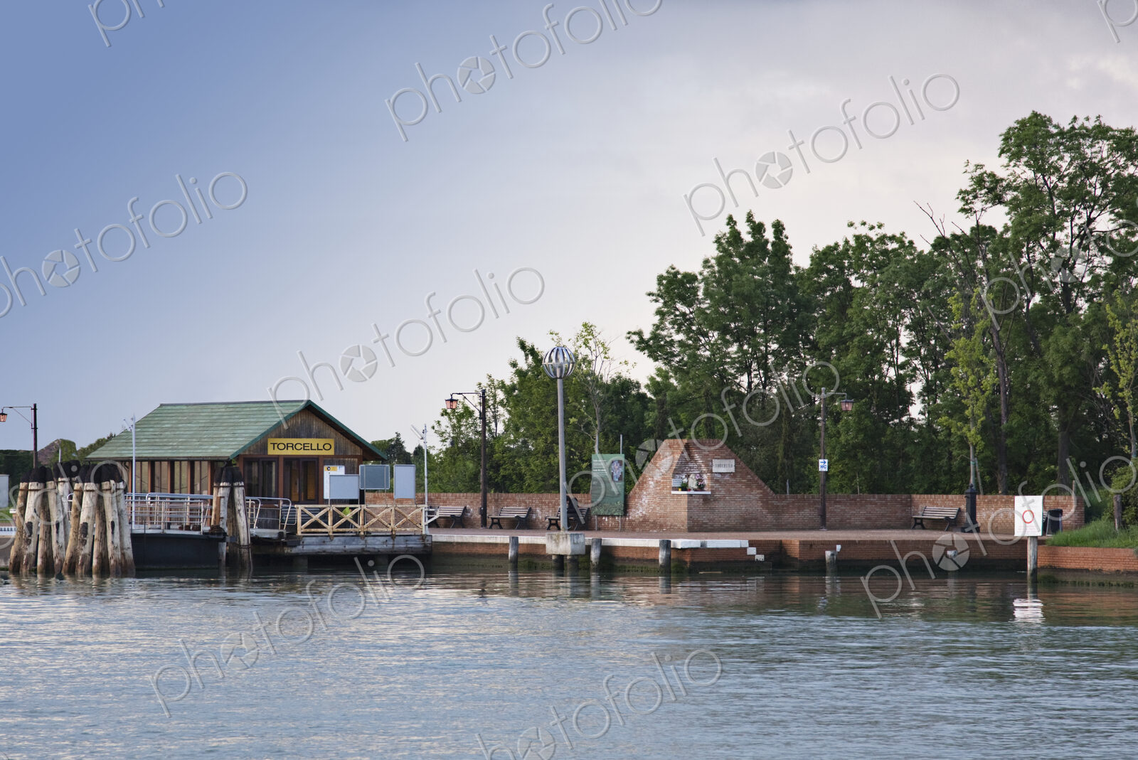 Hut and wall on waterfront.