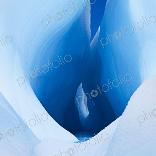 Icebergs and ice formations in the Antarctic. A large fissure or hole in the centre of… Icebergs and ice formations in the Antarctic. A large fissure or hole in the centre of…