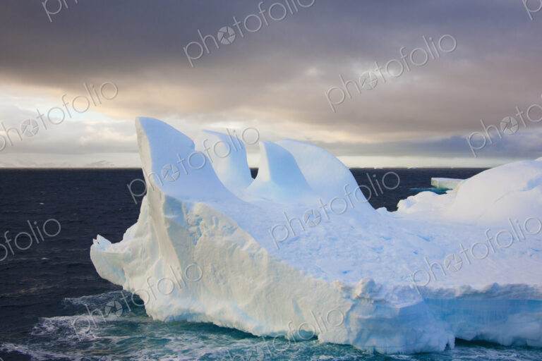 Icebergs floating on the Antarctic southern oceans. Eroded by wind and weather,…