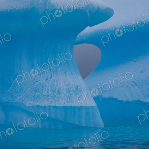 Icebergs with eroding and changing form drifting on the water, Antarctica Icebergs with eroding and changing form drifting on the water, Antarctica