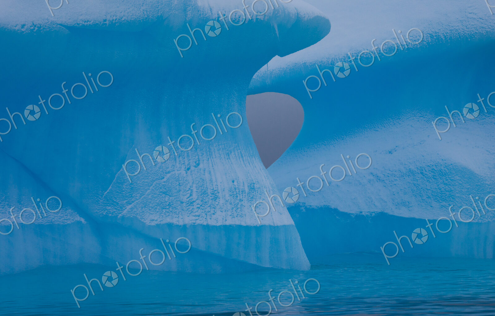 Icebergs with eroding and changing form drifting on the water, Antarctica