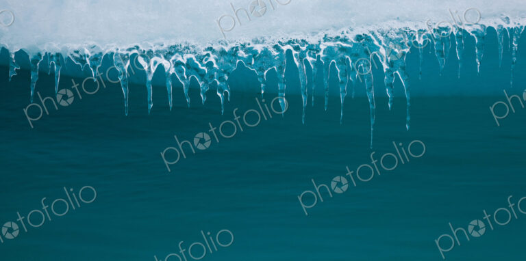 Icicles hanging from an iceberg, Antarctica