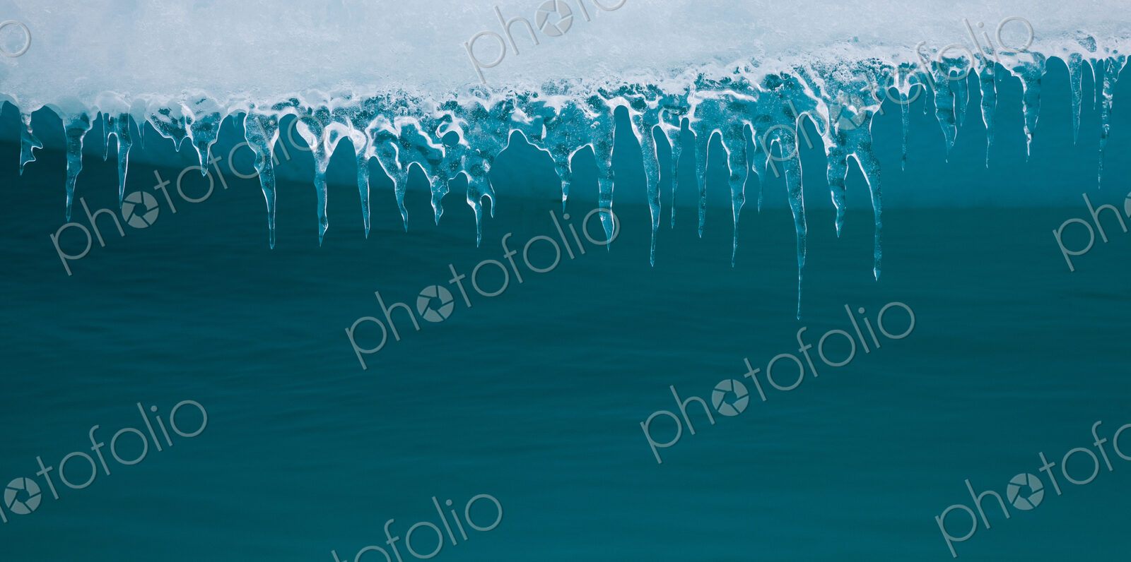 Icicles hanging from an iceberg, Antarctica