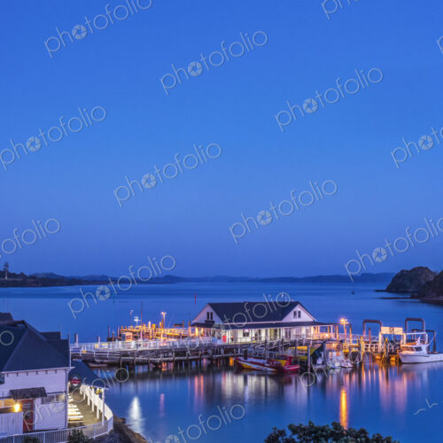 Illuminated building on water at dawn Illuminated building on water at dawn