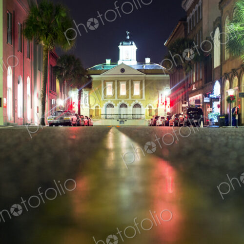 Illuminated buildings along city street at night, Charleston, South Carolina, United… Illuminated buildings along city street at night, Charleston, South Carolina, United…