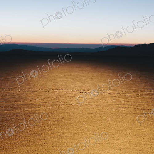 Illuminated desert landscape, dusk