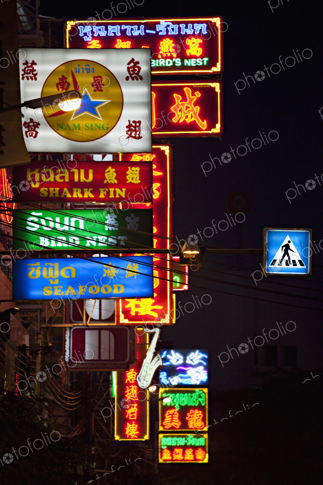 Illuminated downtown Chinatown Street signs in Bangkok