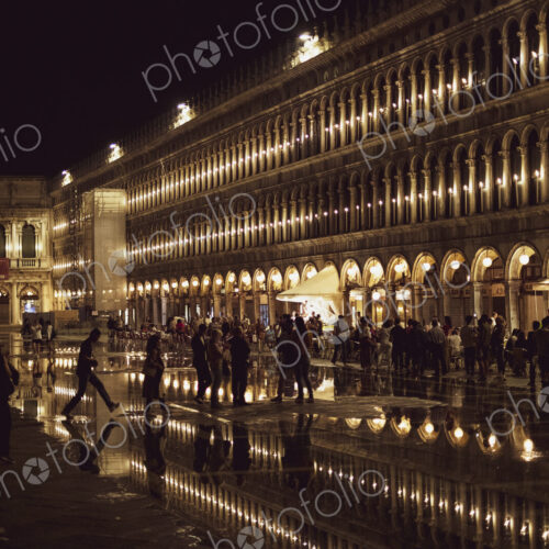 Illuminated facade of the Procuratie Nuove in St Marks Square in Venice, Veneto,…