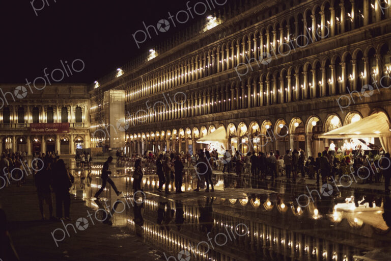 Illuminated facade of the Procuratie Nuove in St Marks Square in Venice, Veneto,…