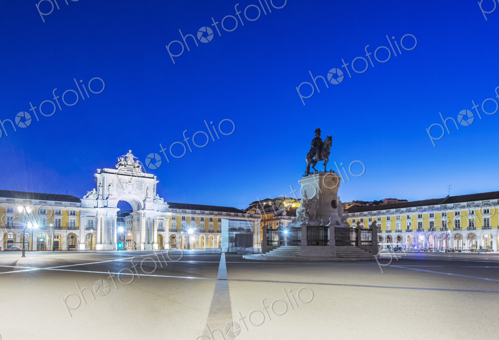 Illuminated fountain and ornate buildings in Commerce Square, Lisbon, Lisbon, Portugal