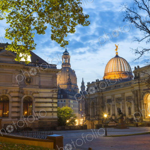 Illuminated town square with facades of domed church, college and sculptures. Illuminated town square with facades of domed church, college and sculptures.