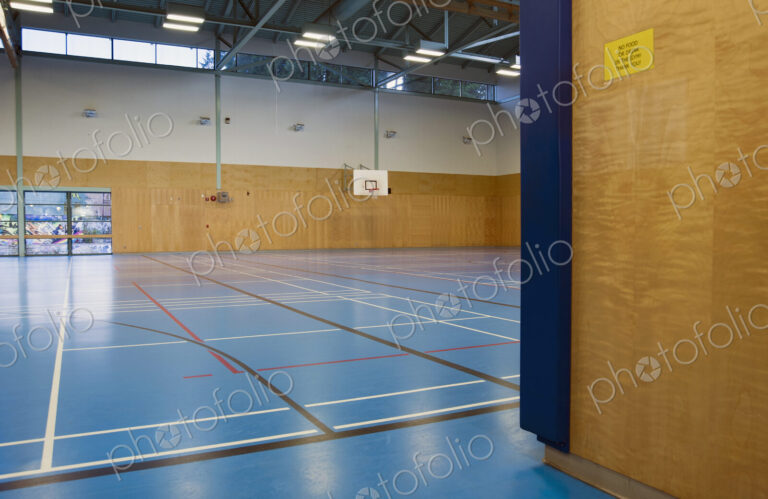Indoor basketball court, epmpty gym, Sign on wall banning food or drink in gym