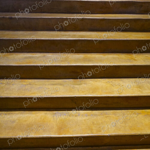 Indoor concrete stairs rising.