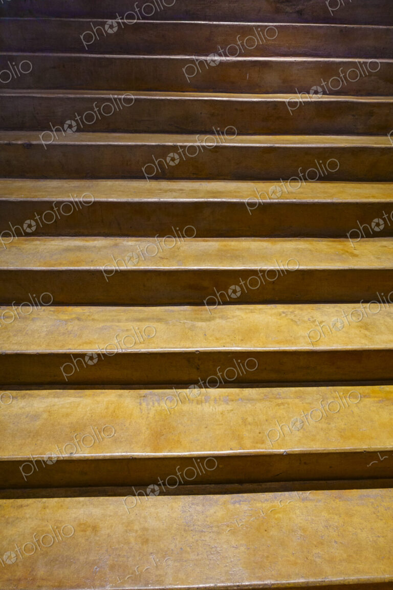 Indoor concrete stairs rising.