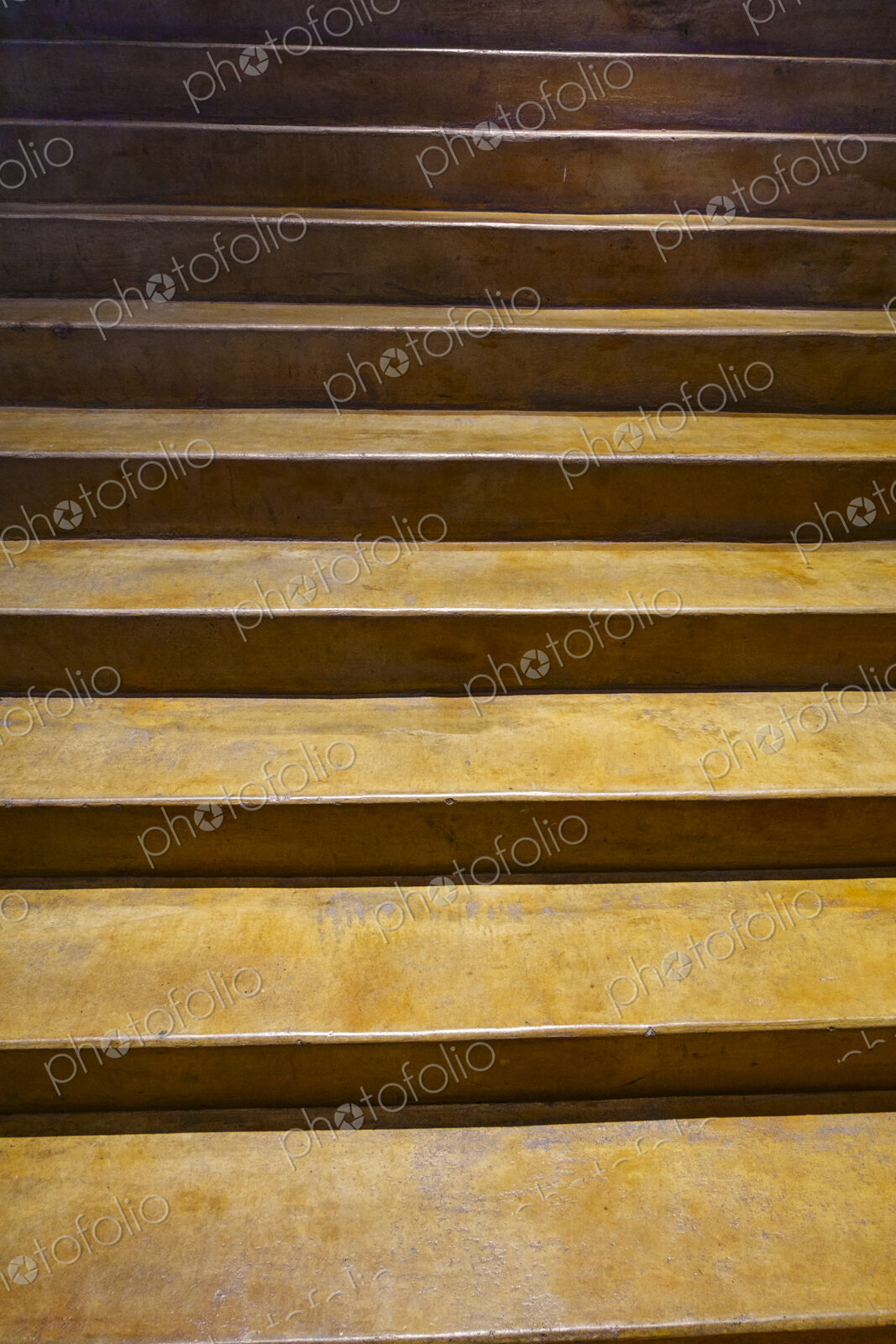 Indoor concrete stairs rising.