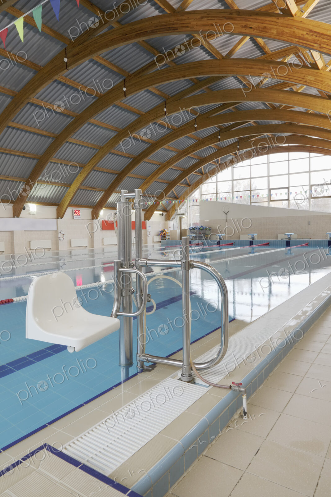 Indoor swimming pool, a chair and hoist for disabled people.