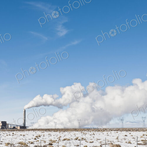 Industrial Complex and Snowy Landscape Under Blue Sky Industrial Complex and Snowy Landscape Under Blue Sky