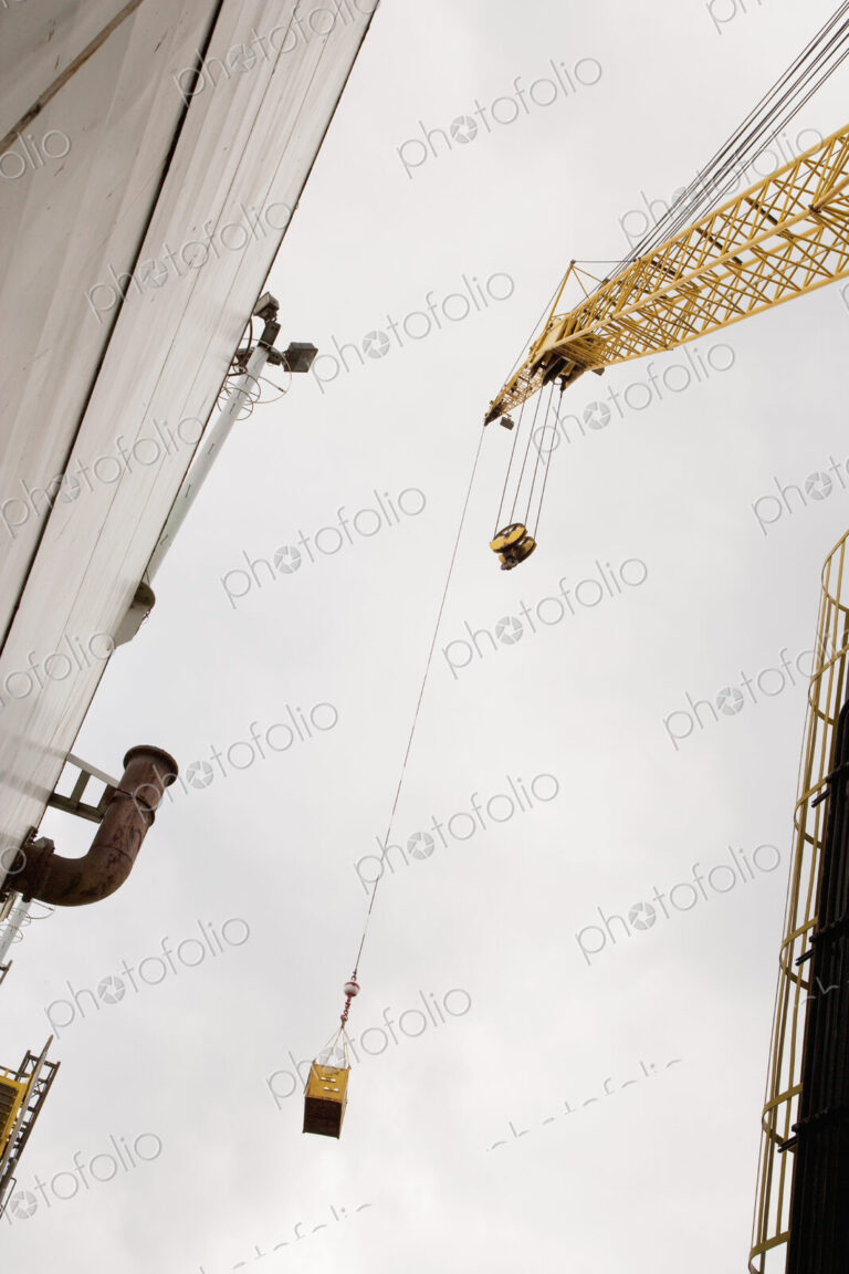 Industrial Crane view from below, moving cargo