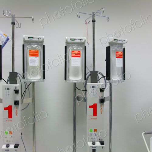 Infusers on drip stands in a modern hospital