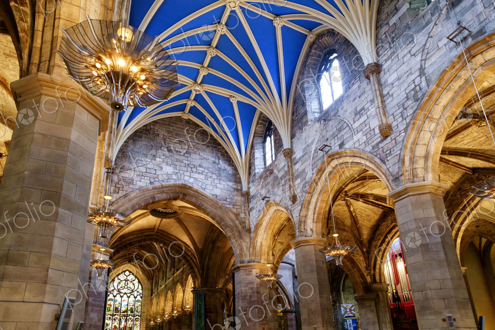 Interior of a church with blue painted vaulted ceiling