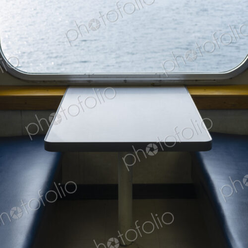 Interior of passenger ferry boat and view over the waters of Puget Sound. Interior of passenger ferry boat and view over the waters of Puget Sound.