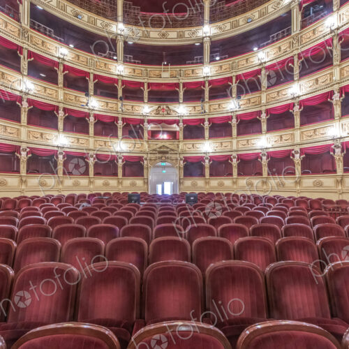 Interior of the Teatro Verdi, red velvet seats in the auditorium, Trieste, Italy. Interior of the Teatro Verdi, red velvet seats in the auditorium, Trieste, Italy.