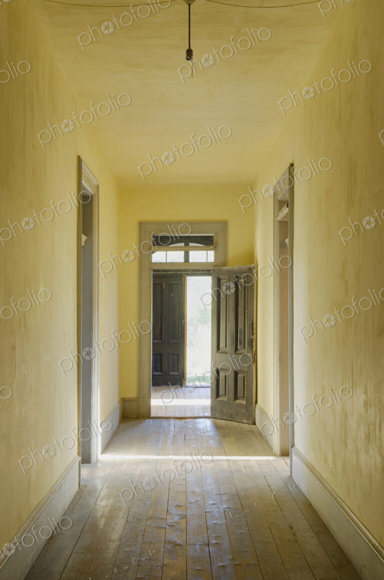 Interior view of a corridor in an abandoned building in Montana State Park.