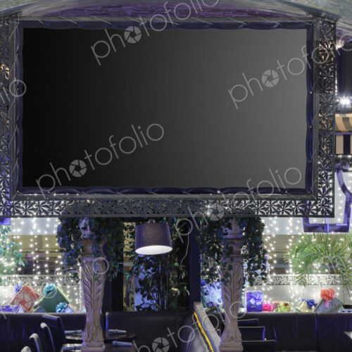 Interior view of a flat screen TV in restaurant.